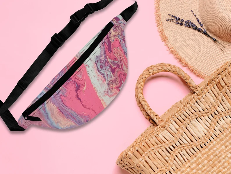 pink fanny pack with abstract pink and purple design. The soft pink everyday fanny pack has an adjustable pink belt strap, making it a pink fashion belt pouch for women and part of the Greek summer fanny packs by Sea Sun Stories.