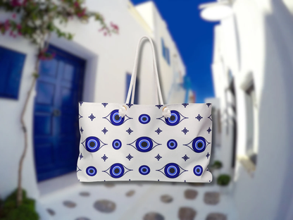 This blue and white Greek bag is captured in Mykonos island. As a Greek style bag for the beach, it holds your beach essentials with ease. Rope handles make it easy to carry while traveling to Greece. This Greek evil eye protection bag is practical and symbolic.