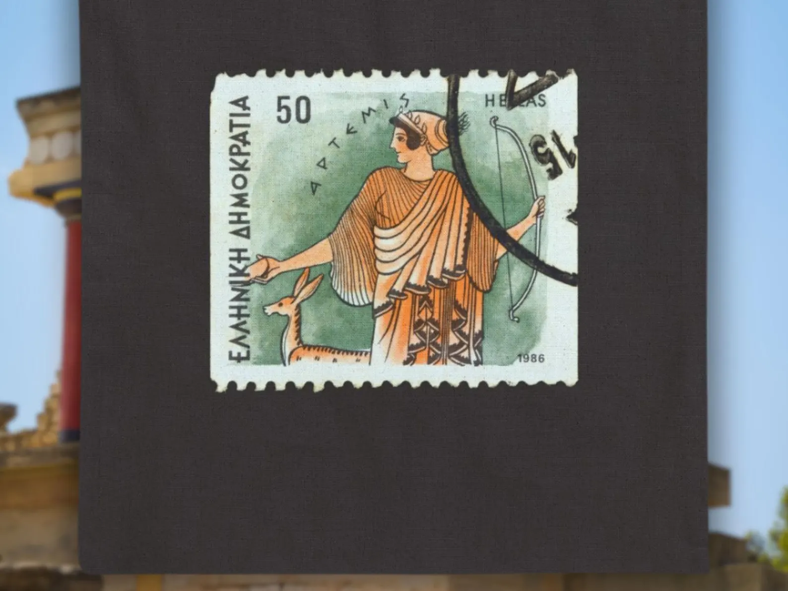 A close-up of the upper half of the vintage 1986 Greek stamp printed on the Artemis tote, showing detailed Greek lettering and Artemis in traditional robes. This Greek mythology bag reflects Diana goddess imagery and brings ancient myths into modern fashion through Sea Sun Stories bags.