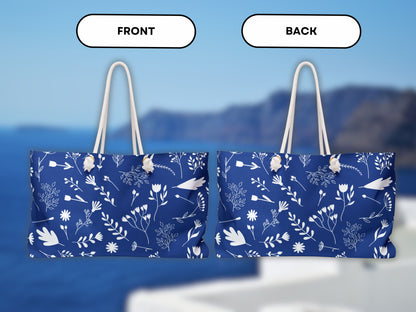The image displays both the front and back of the stylish blue and white Greek style bag. Featuring rope handles and a clean design, this Greek shoulder bag from Sea Sun Stories works great as a summer tote bag or tote bag for Greece. A great choice for those who love Greek travel accessories.