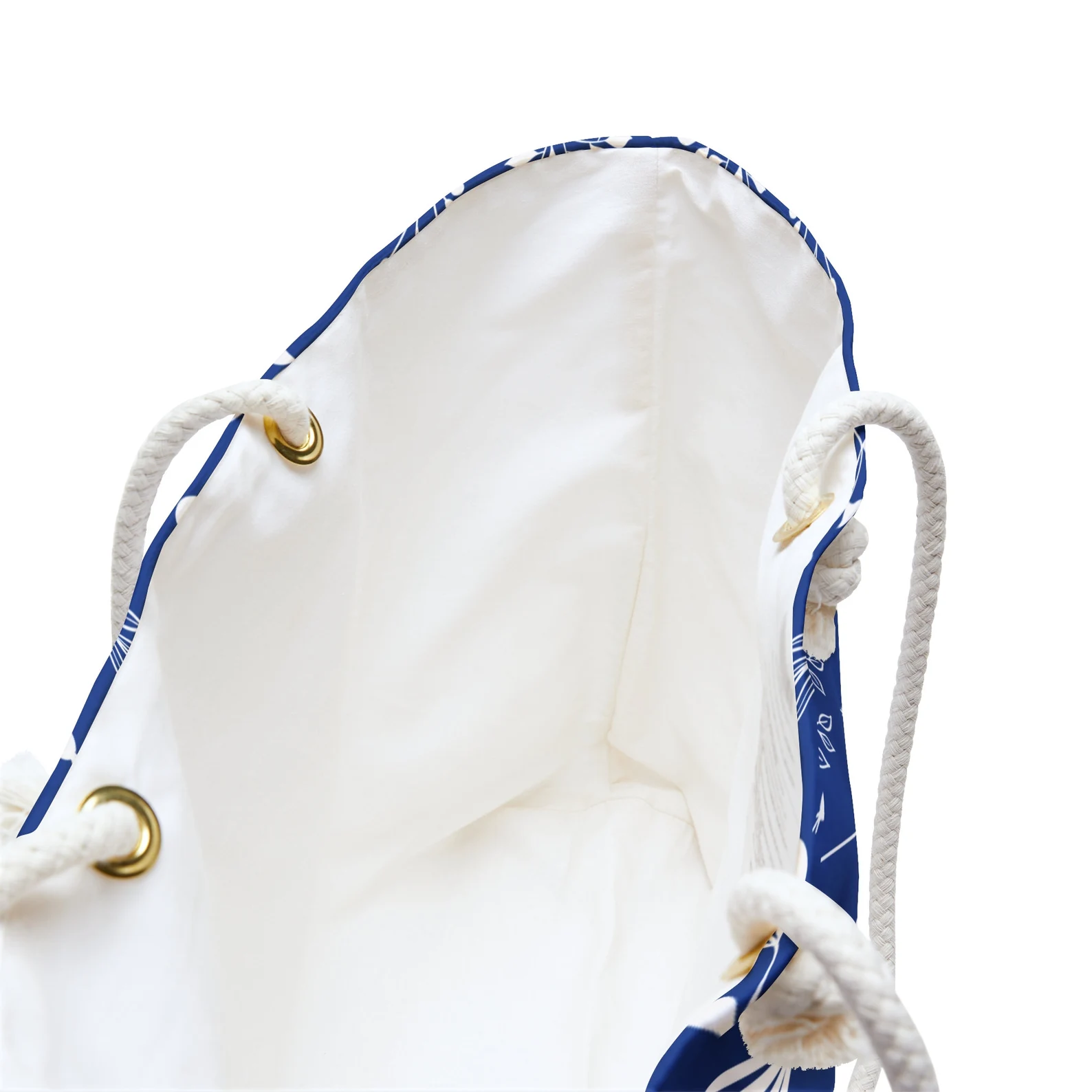 This close-up image shows the inside of the large summer bag, featuring one spacious compartment. Designed as a large bag for all your beach essentials or city travel needs. A must-have stylish beach bag for vacations, this design fits everything from towels to snacks with ease and elegance.