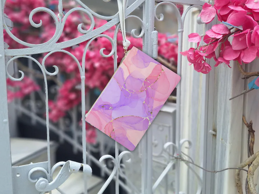 This striking pink clutch bag features a vibrant abstract marble clutch design, incorporating beautiful pink, purple, and gold tones. As a vegan clutch purse, it offers a luxurious feel. This unique marble design bag makes a bold pink clutch bag statement, embodying modern elegance.