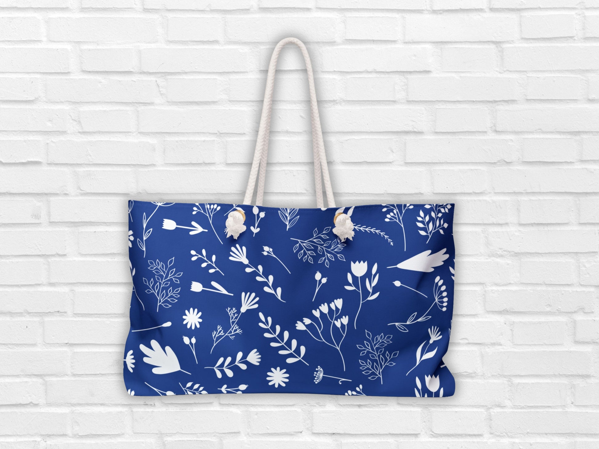 This image showcases the blue and white tote from Sea Sun Stories, highlighting the thick nautical-style rope handles. A great bag for the beach or as a travel tote for women, this large blue bag reflects the charm of Greek coastal living while offering modern functionality.