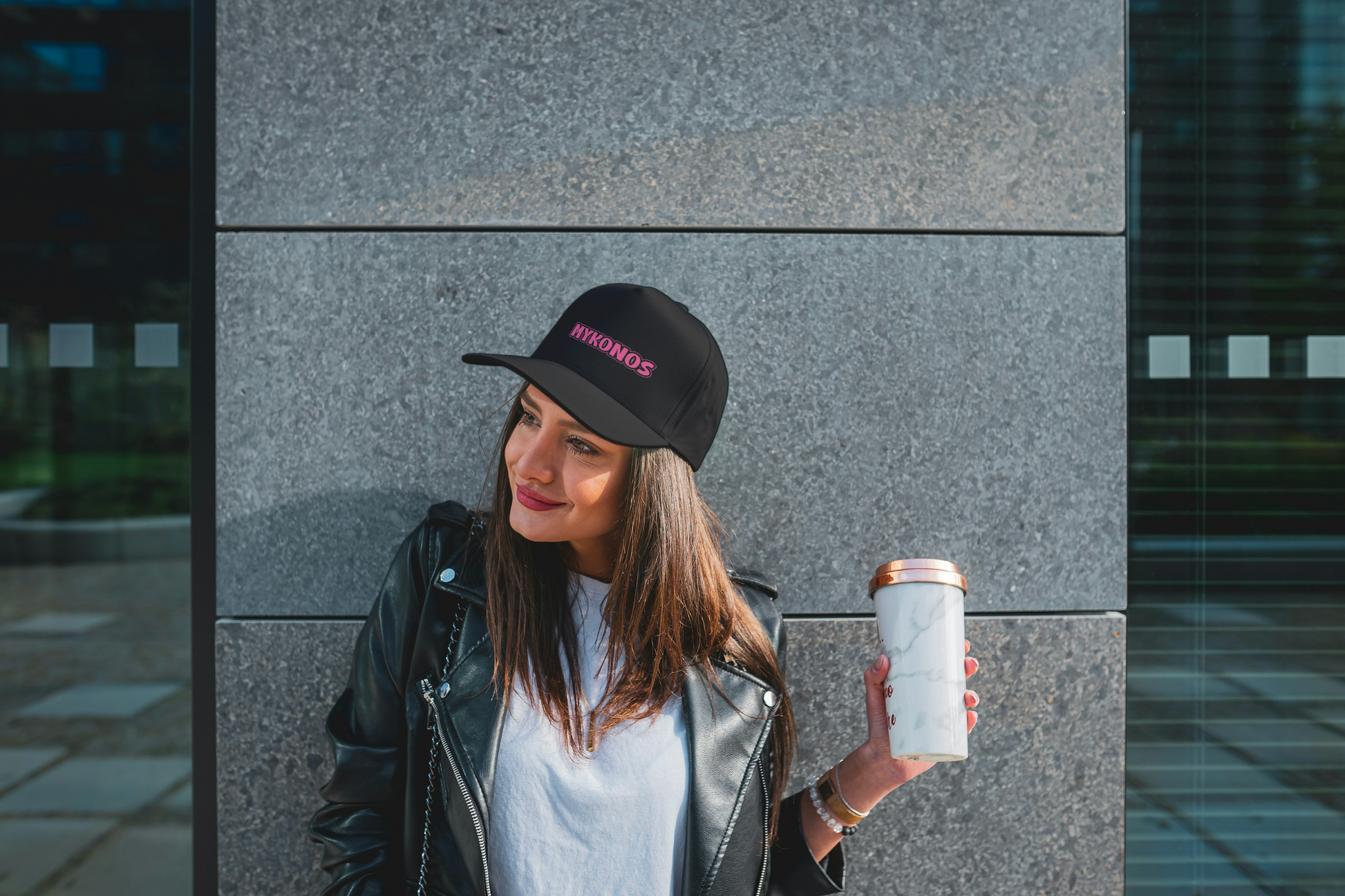 Street style look with Pink Mykonos Cap worn by a woman on a sunny day. This Mykonos Souvenirs piece from Sea Sun Stories is an ideal bachelorette mykonos gift.