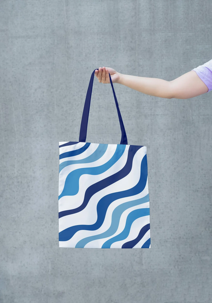 A close-up image of the Blue Tote Bag, highlighting the details of the blue and white pattern and the texture of the fabric. This image allows you to appreciate the artistry and quality of the bag's construction. The vibrant colors and intricate design make it a unique and stylish accessory. This image showcases the bag's high-quality materials and craftsmanship.