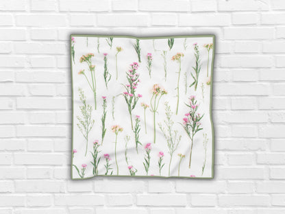 Image emphasizing the delicate floral details of this botanical scarves.