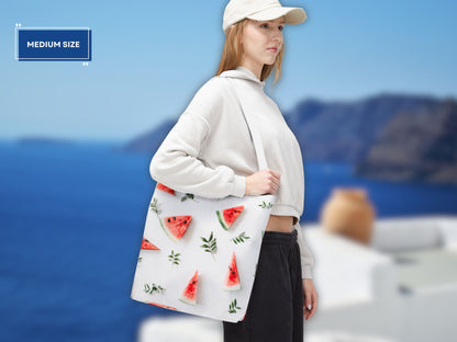 woman holding the medium watermelon bag, demonstrating its size and versatility. This image showcases how this watermelon tote bag is ideal for shopping trips or a day at the beach. The watermelon design adds a fun and summery touch, making it a perfect beach tote bag. This shoulder bag fruit option is both practical and stylish. The medium size makes it a great reusable shopping bag.