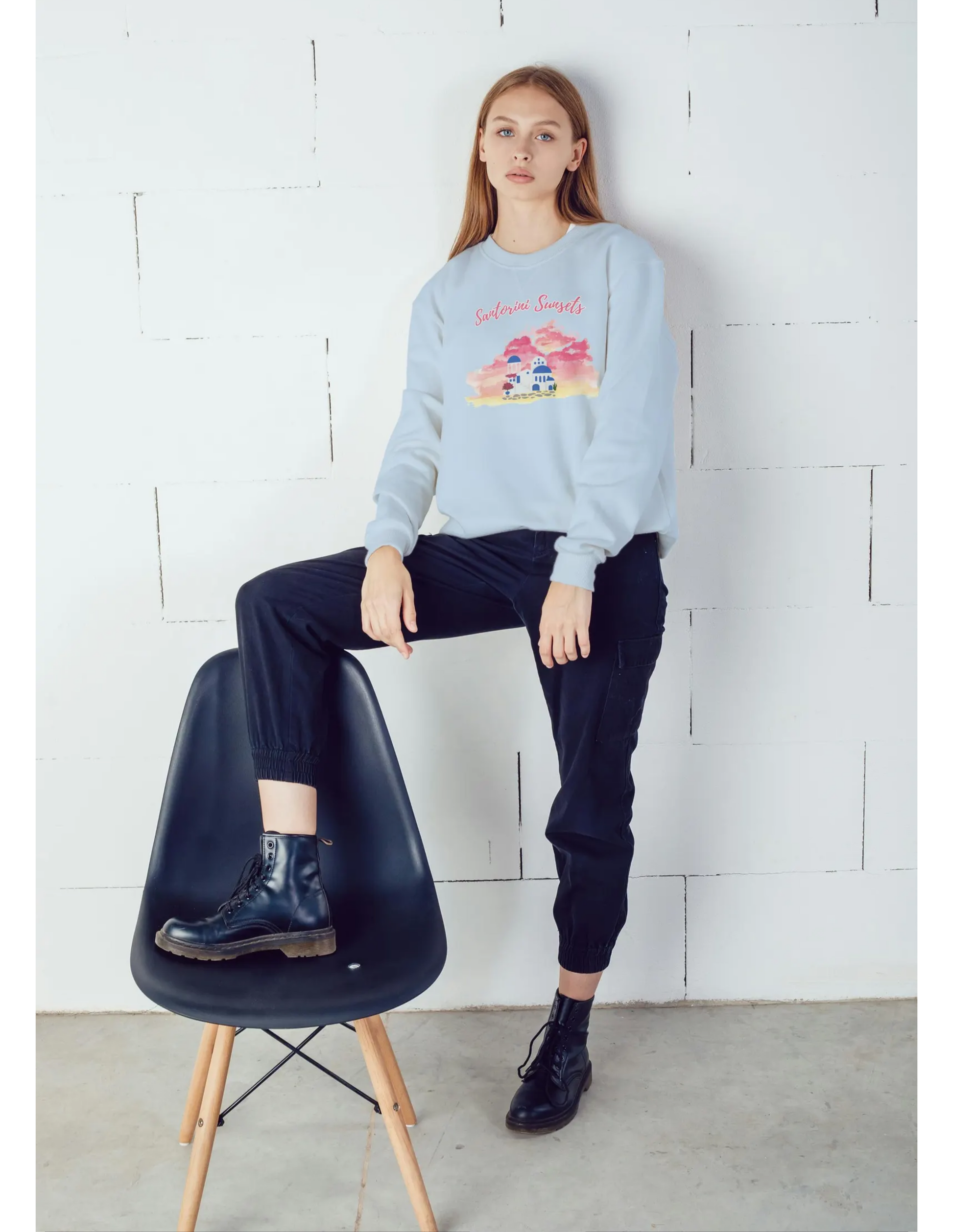 A model wearing the Greece crewneck in a relaxed setting, highlighting its comfortable and easy-going style.