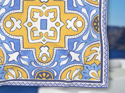 Detailed flat lay highlighting the vibrant yellow navy scarf colors on this blue yellow foulard.